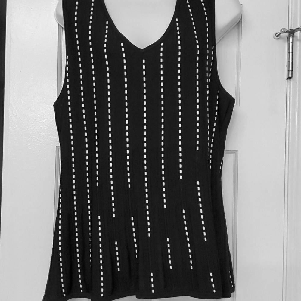 Black with with stitching tank. Never worn tags on